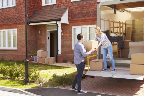 Removal team sorting recyclable moving materials in Richmond upon Thames
