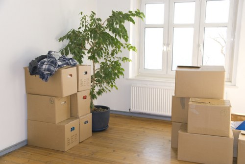 Professional movers loading furniture into a moving truck in Richmond upon Thames