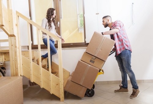 Careful loading of boxes and furniture into a moving van in Richmond upon Thames