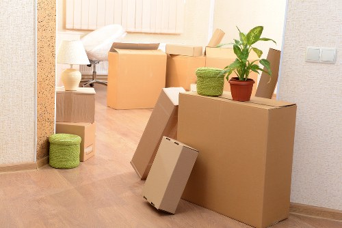 Staff member handling furniture using careful moving techniques